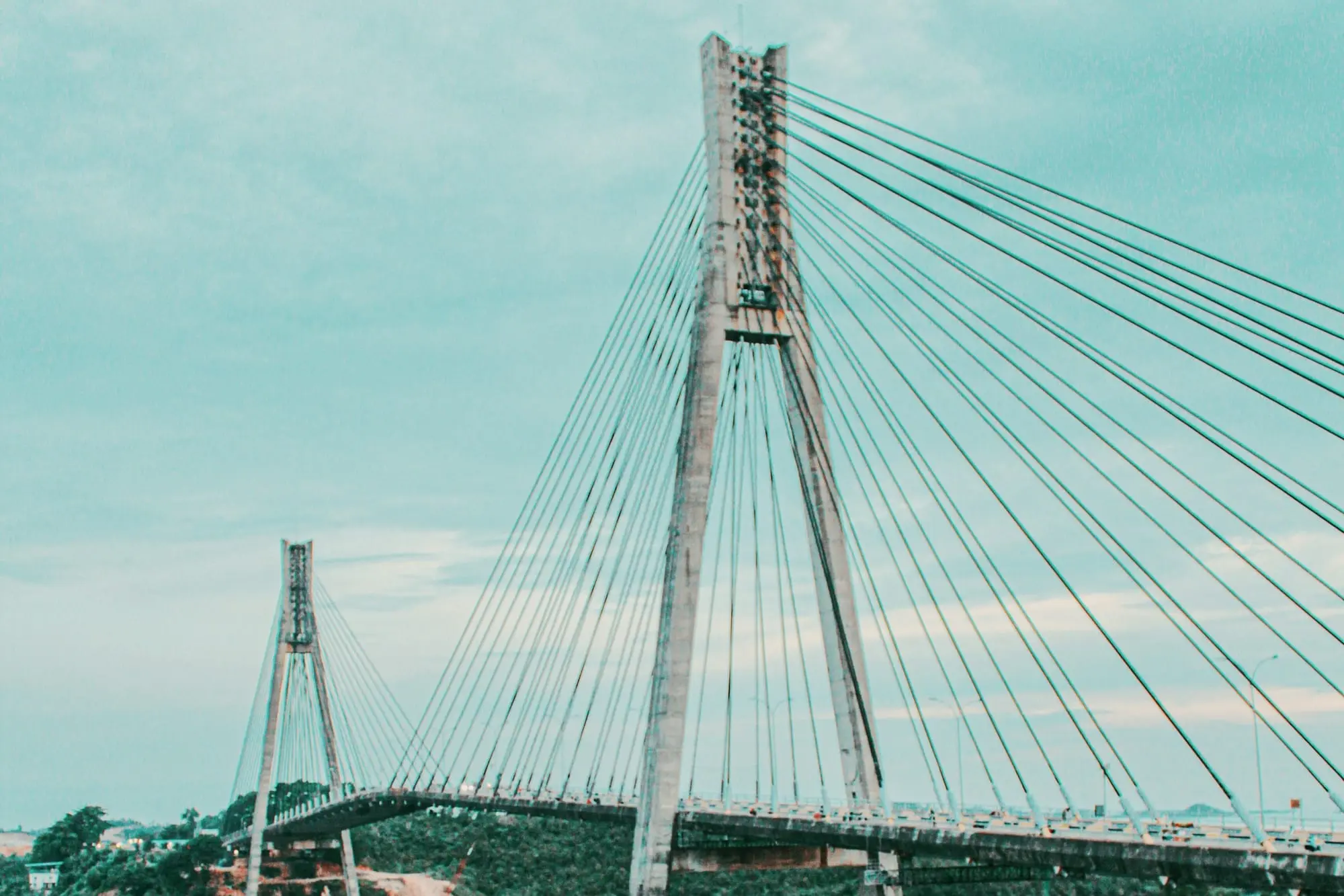 Tengku Fisabilillah Bridge with its two pylons over the strait, on the Trans Barelang road that leads south to Galang Island